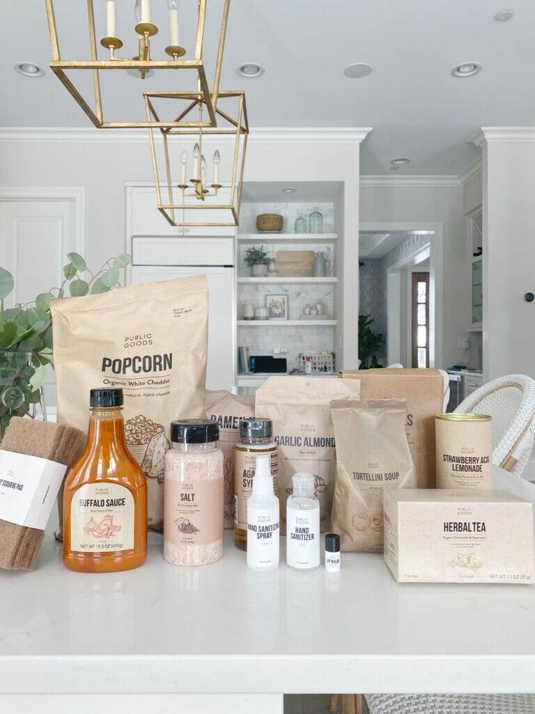 My favorite Public Goods Shopping Clean Essentials with Public Goods | Pretty white kitchen features open shelving, brass fixtures, benjamin moore classic gray walls and ceasarstone frosty carrina countertops.