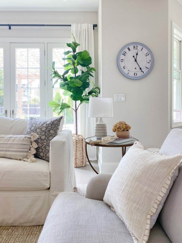 Neutral Fall Colors & Textures living room decor, pretty linen pillow, end table with textured lamp and faux fall arrangement