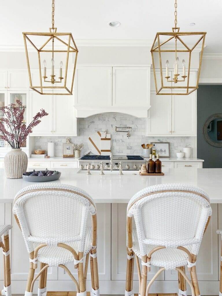white kitchen cabinets white kitchen cabinets with counter stools and brass lanterns