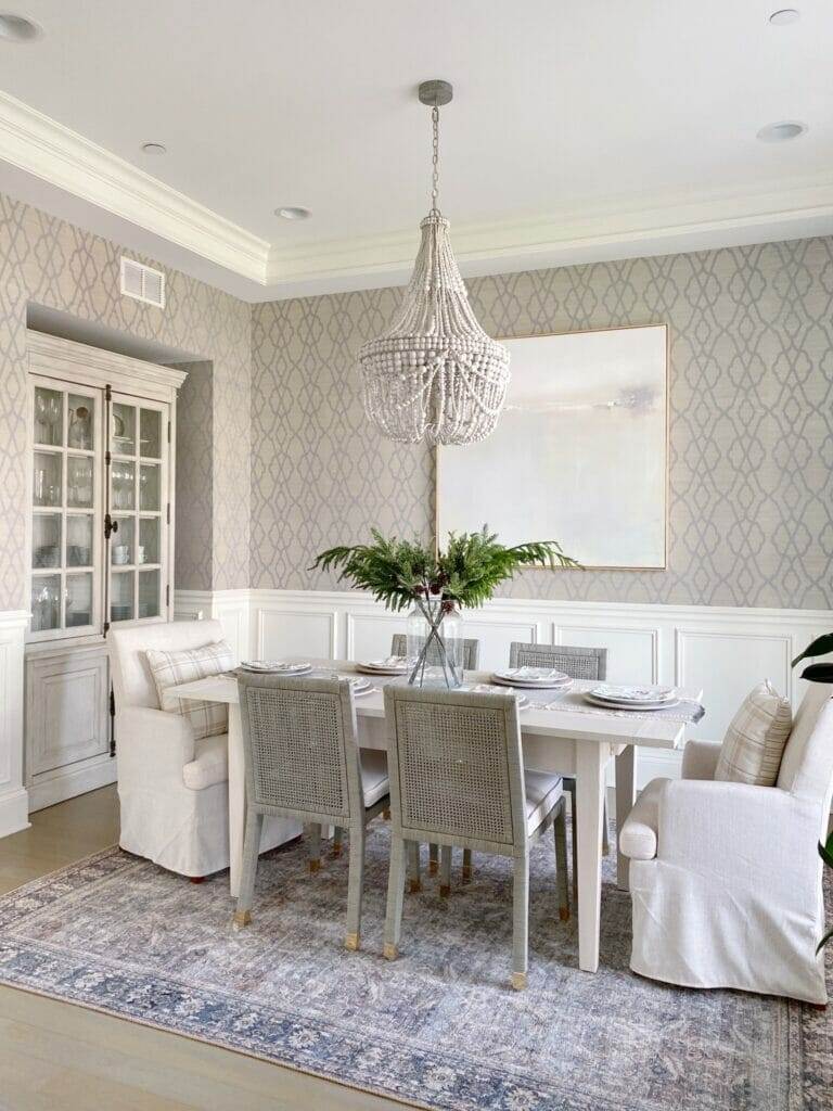 dining room update featuring Serena & Lily Beach House dining table and Balboa side chairs, beaded chandelier, and loloi rug