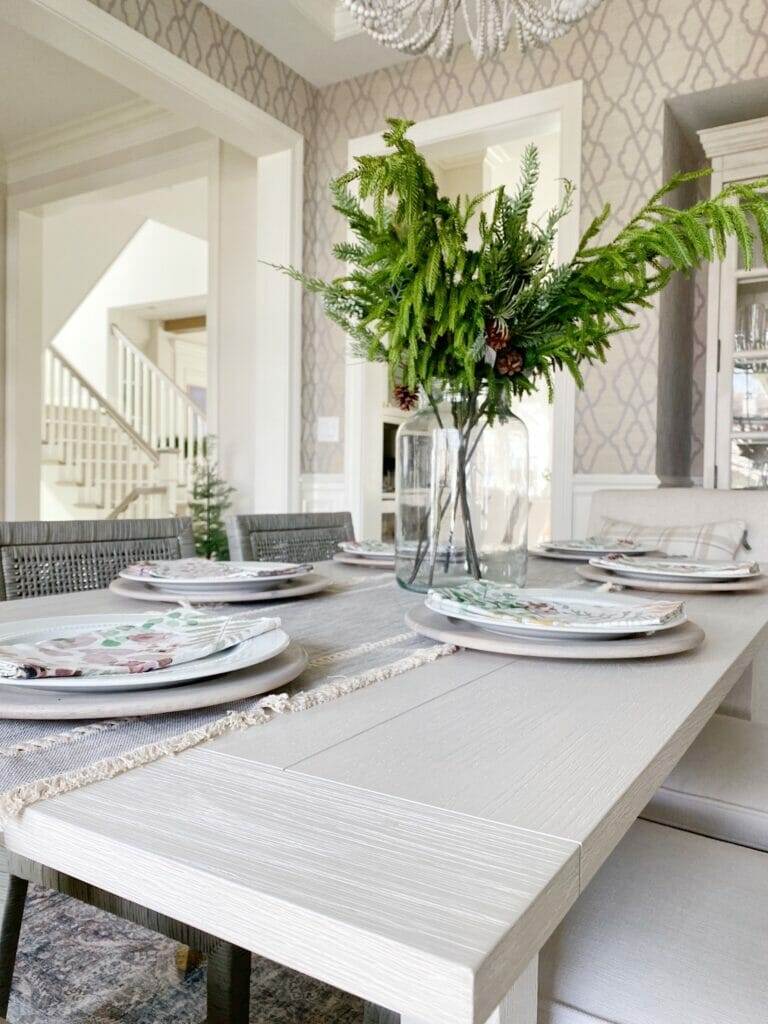 Serena & Lily Beach House dining table dining room update featuring Serena & Lily Beach House dining table and Balboa side chairs, beaded chandelier, and loloi rug