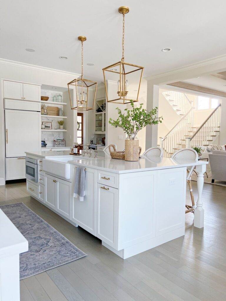 kitchen island rattan vase How to style a white kitchen island with rattan vase with greenery